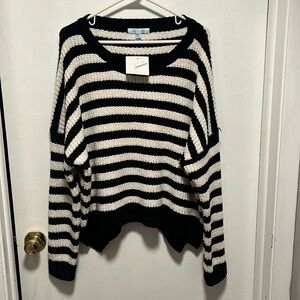 Brand new, with tags, extra soft black and white striped sweater.